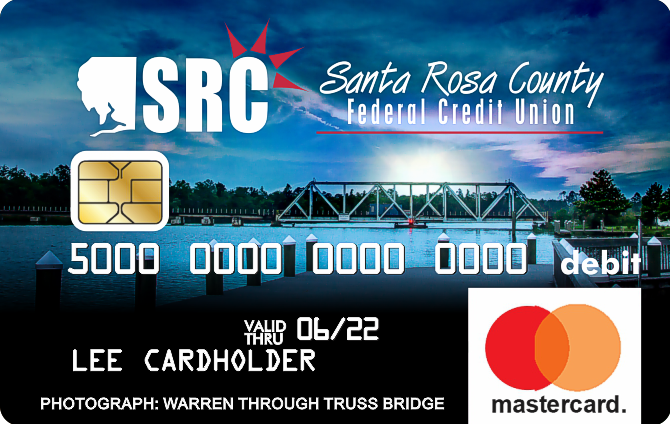debit card with photo of boat dock on the water in the evening